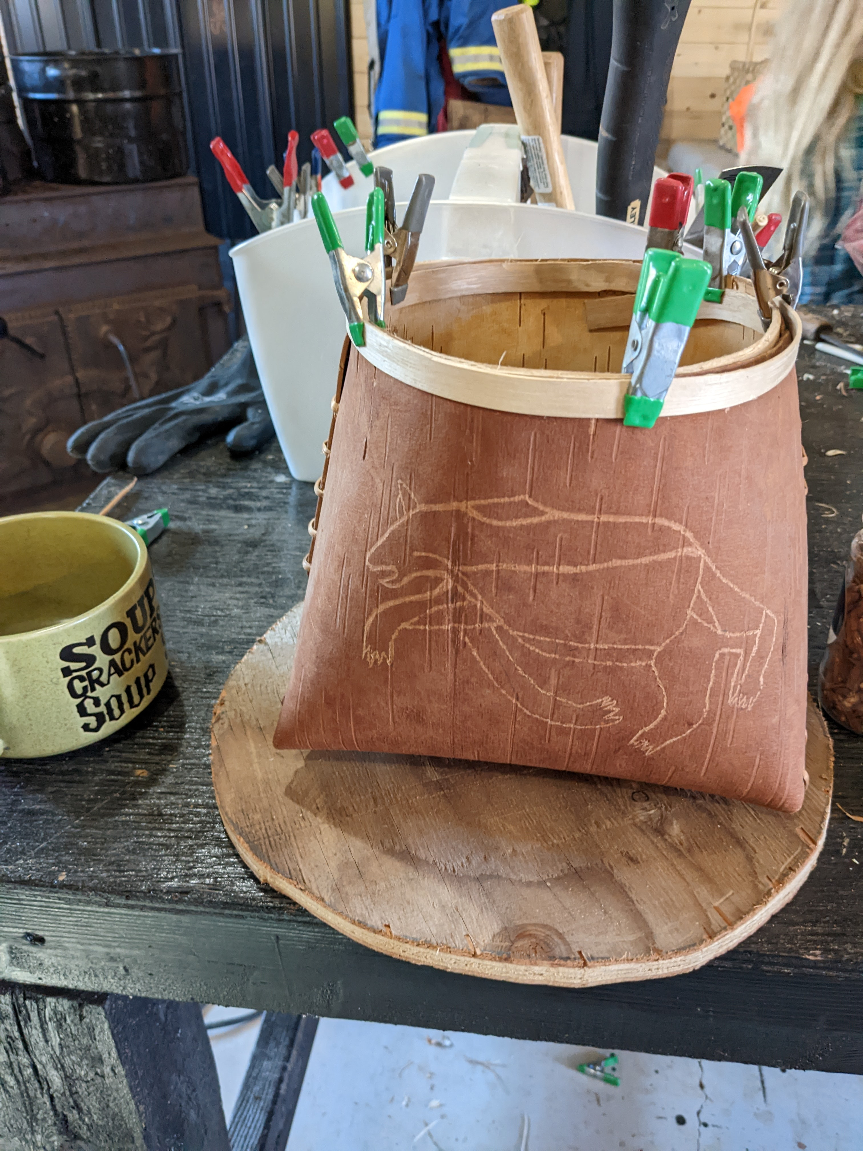 Birch bark basket with caribou carving